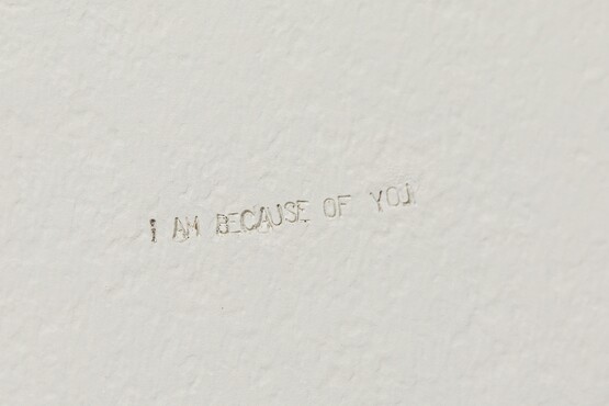 Navid Nuur, I AM BECAUSE OF YOU, 2008-2020, stainless steel letters stamps pressed into a wall. Photo: Bram Vreugdenhil. 