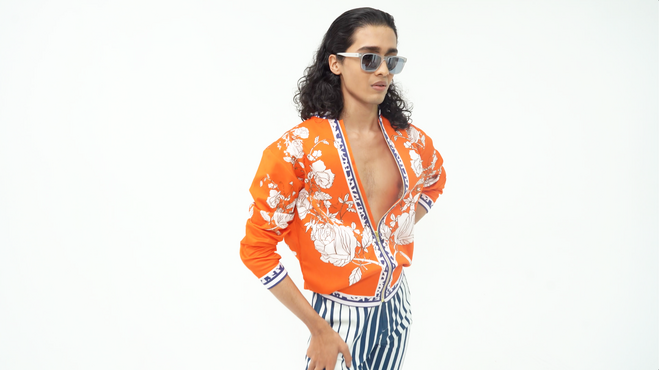 Mr Ajay Kumar, India, summer 2020, Diso Orange Bomber jacket with Firdaus-Paradise theme, and Eric Blue Striped trousers, lycra. Courtesy Mr Ajay Kumar.