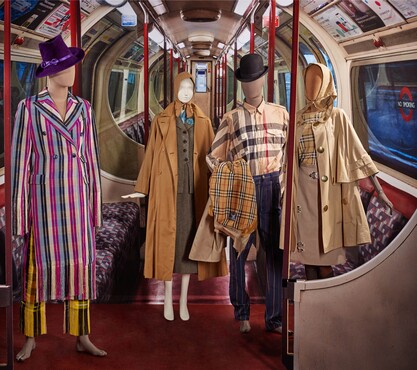 Kenneth Ize, Coat and trousers in aso oke weave technique, Nigeria, fall 2019; Charles Creed, Suit,  London, 1950; Burberry, three raincoats (ca. 1948, ca. 1990-1999, ca. 2005-2010), shirt, t-shirt (ca. 1990-1999) and skirt (2014); Paul Smith, trousers, ca. 1996, Kunstmuseum Den Haag. Photo: Alice de Groot
