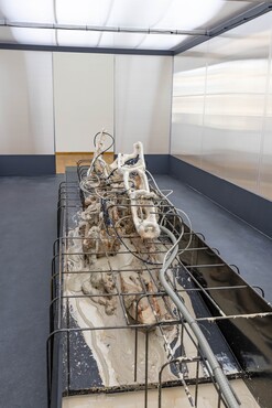 Mire Lee, As we lay dying, 2022, casting clay, unfired clay, fired clay, pump, water spray, rebars and other mixed media.